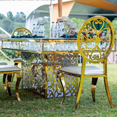 قیمت خوب میز ناهارخوری لوکس هتل از جنس استیل ضد زنگ با آویز کریستالی و شیشه طلایی برای ضیافت‌ها، رستوران‌ها و مهمانی‌ها آنلاین